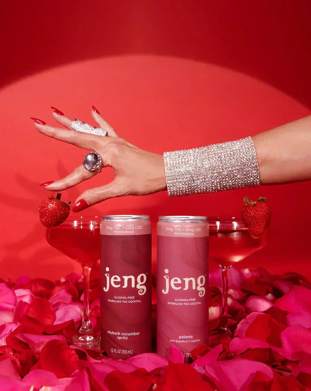 Jeng sparkling cocktail cans styled with martini glasses, strawberries, and rose petals for a romantic Valentine’s date night.