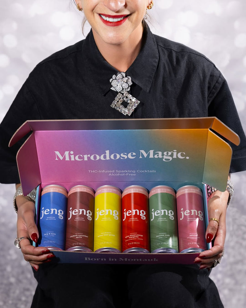 Smiling woman holding a colorful Jeng Microdose Magic variety pack filled with assorted THC cocktail cans.