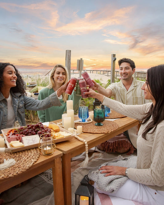 Four friends at brunch enjoying Jeng’s sparkling, THC-infused, alcohol-free cocktails for GLP-1 users.