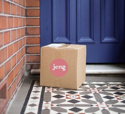 A package of Jeng placed in front of a blue door, symbolizing the arrival of a new unwind ritual.