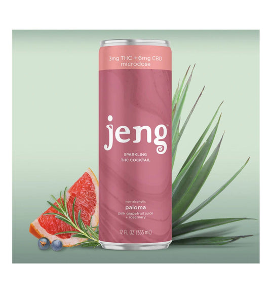 A pink can of Jeng Sparkling THC Cocktail, Paloma flavor, next to a grapefruit slice and rosemary.