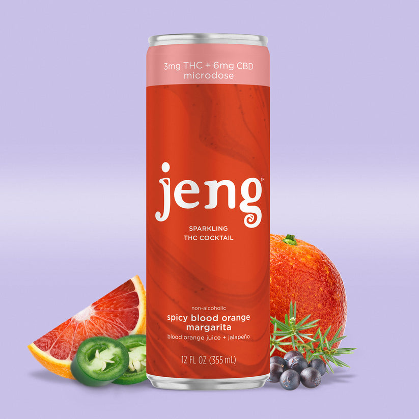 A can of Jeng's THC-infused Spicy Blood Orange Margarita, offering a zesty twist for your beachside relaxation.